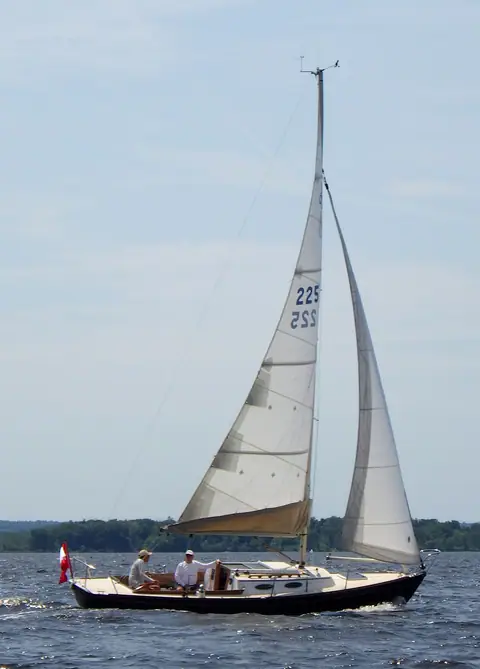 Alerion Express 28 under sail with crew in the cockpit