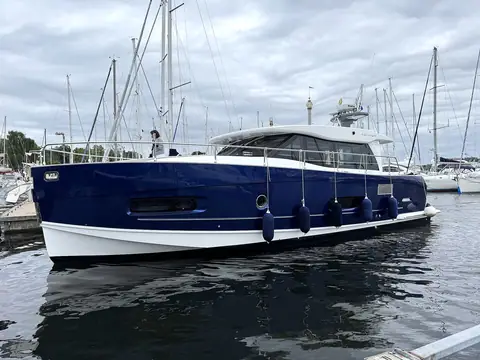 Blue-hulled Azimut motor yacht in a Stockholm guest harbor