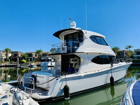 Maritimo M48 flybridge cruiser at a marina in Queensland, shown for reference