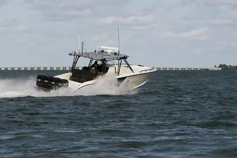 Midnight Express center console patrol boat running at speed