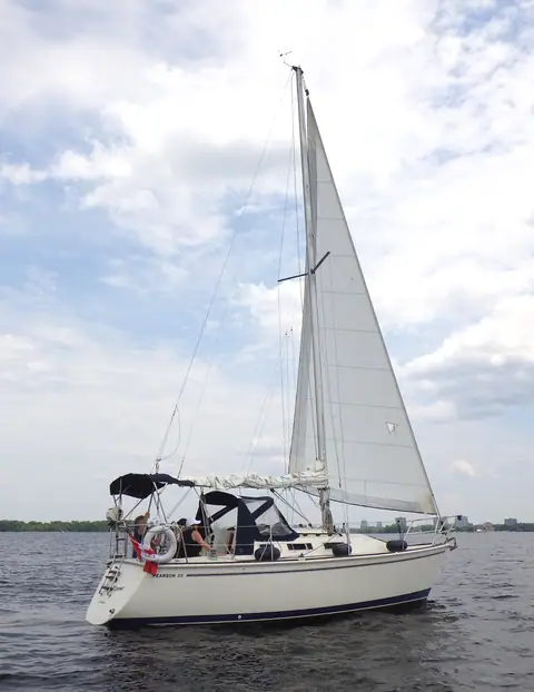 Pearson 28-2 sailing with a bimini over the cockpit