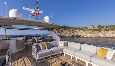 Absolute Navetta 64 flybridge with sun lounge seating under the hardtop