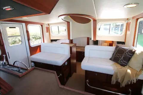 American Tug 365 pilothouse settees and salon looking aft to the cockpit door
