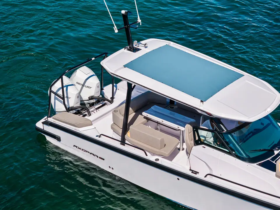 Axopar 29 Sun Top from above showing the glass roof canopy, cockpit seating and single outboard