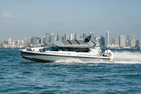 Axopar 37 XC Cross Cabin in profile showing the enclosed cabin and open bow seating