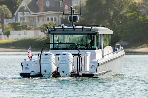 Axopar 37 XC Cross Cabin from astern with twin outboards and the aft cockpit