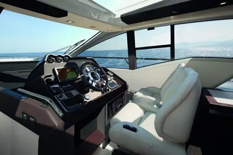 Azimut 55S lower helm with twin white helm seats and a curved dashboard