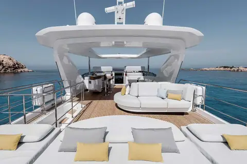 Azimut Grande 27 Metri flybridge with sun pads, lounge sofa and helm under the hardtop