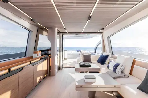 Azimut S7 main salon with light oak floor, sofas and large side windows