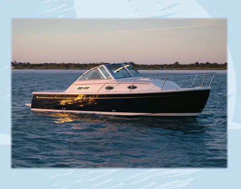 Back Cove 26 with a dark blue hull at rest on calm water at dusk, port side view