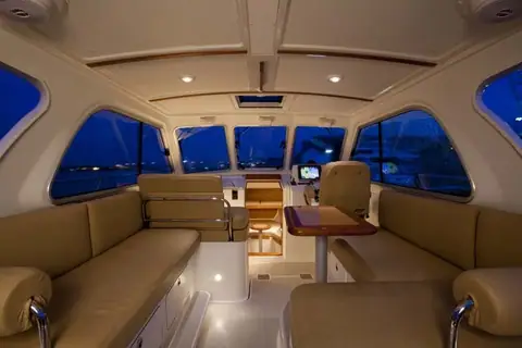 Back Cove 30 enclosed helm deck with leather seating and the dinette under the hardtop