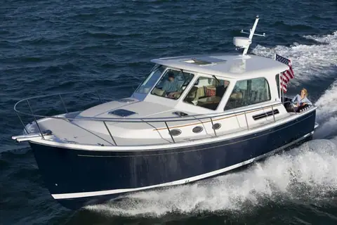 Back Cove 37 seen from the bow quarter while cruising with an American flag astern