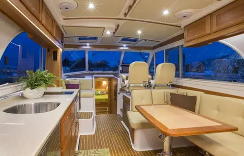 Back Cove 41 saloon with galley, dinette and twin helm seats under the hardtop