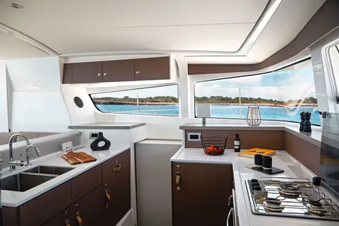 Bali 4.2 galley with double sink, oven and gas hob along the forward windows