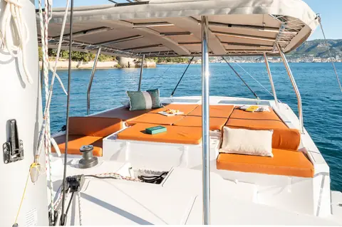 Bali Catspace flybridge sun lounge with orange cushions under the bimini