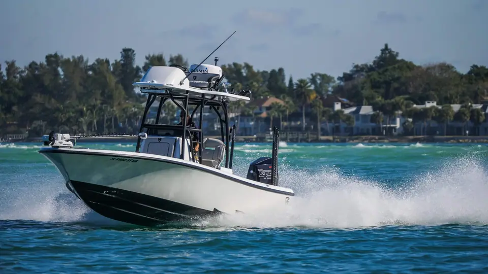 Barker 26 Open running fast with a dark hull and white T top