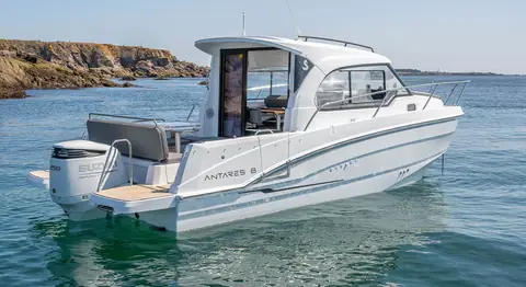 Beneteau Antares 8 at rest seen from the stern quarter with its Suzuki outboard