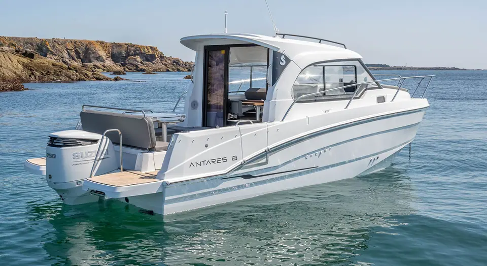 Beneteau Antares 8 at rest seen from the stern quarter with its Suzuki outboard