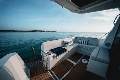 Beneteau Antares 9 cockpit with bench seating and teak style sole