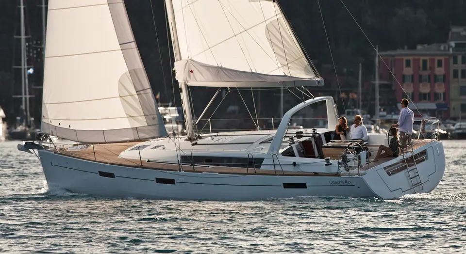 Beneteau Oceanis 45 at anchor in profile with crew on deck