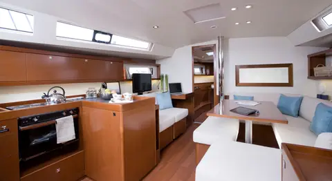 Beneteau Oceanis 45 saloon with mahogany joinery, galley and dinette