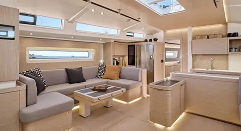 Beneteau Oceanis Yacht 60 saloon with U shaped settee, coffee table and galley aft