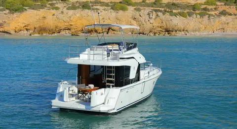 Beneteau Swift Trawler 35 at anchor seen from astern with the cockpit and flybridge ladder