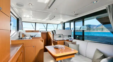 Beneteau Swift Trawler 35 saloon with galley, dinette and wraparound windows