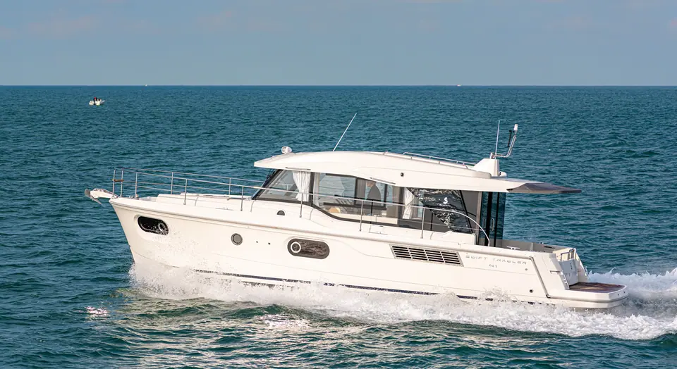 Beneteau Swift Trawler 41 Sedan running in profile on open water