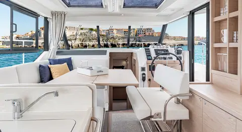 Beneteau Swift Trawler 41 saloon with dinette, galley and lower helm forward
