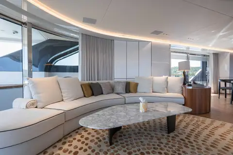 Benetti Oasis 40M Oreos main saloon with curved sofa and marble coffee table