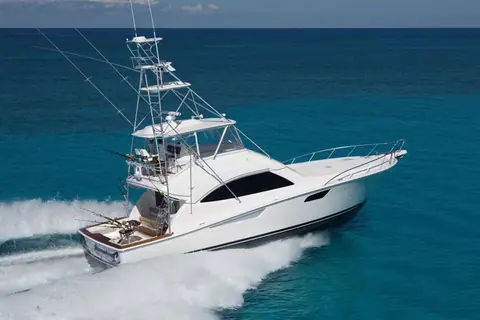 Bertram 54 Convertible with a tuna tower running at speed offshore