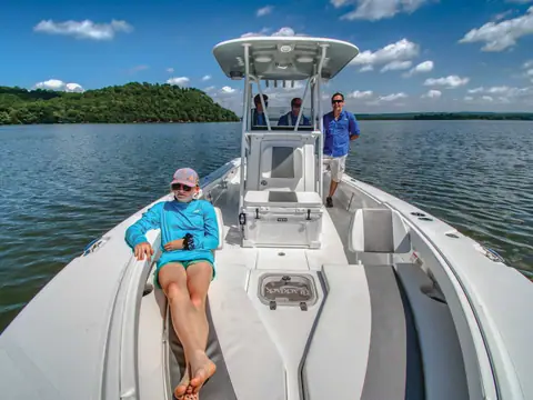 Bow deck and center console of the BlackJack 256 Coastal on a lake