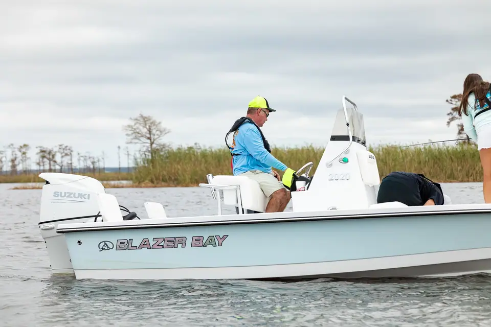 Blazer Bay 2020 in profile with anglers aboard and a jack plate mounted outboard
