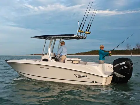 Boston Whaler 220 Outrage drifting with an angler casting from the cockpit