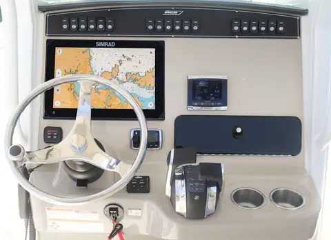 Helm console of the Boston Whaler 250 Outrage with a Simrad display