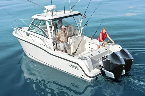 Boston Whaler 285 Conquest stern quarter view with anglers in the cockpit