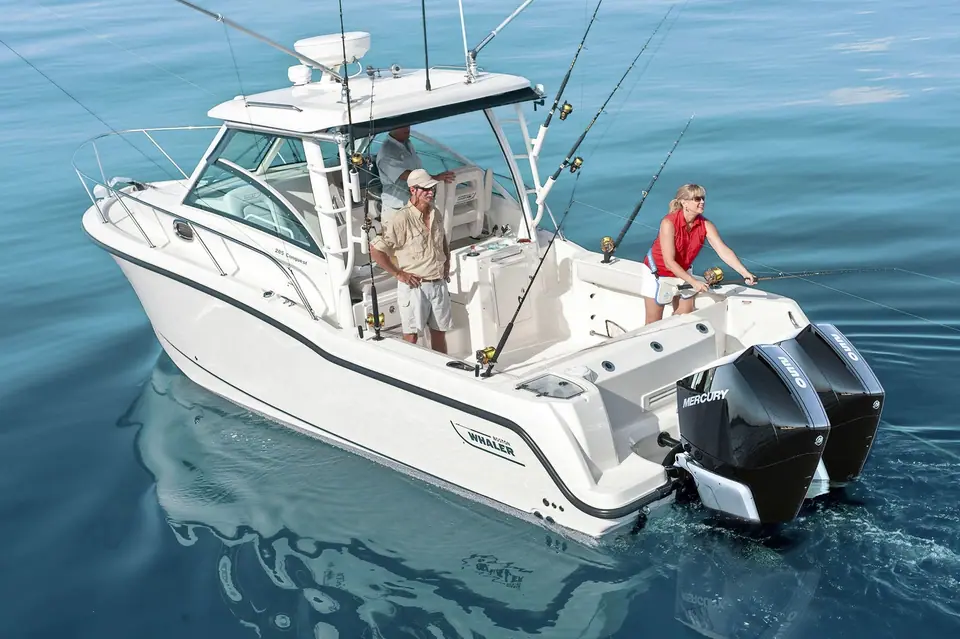 Boston Whaler 285 Conquest stern quarter view with anglers in the cockpit