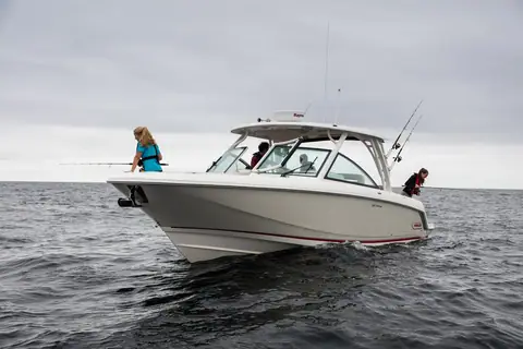 Boston Whaler 320 Vantage drifting with anglers fishing from the bow and cockpit