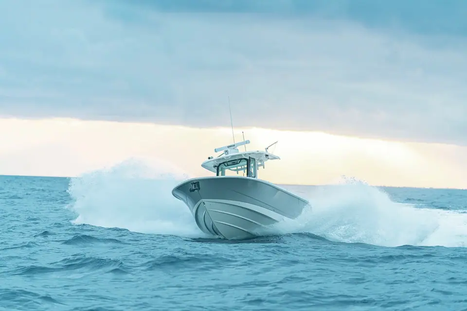 Boston Whaler 330 Outrage running head on through a wave