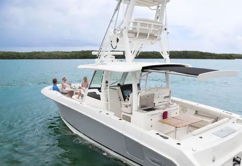 Boston Whaler 380 Outrage at rest with guests in the cockpit and bow