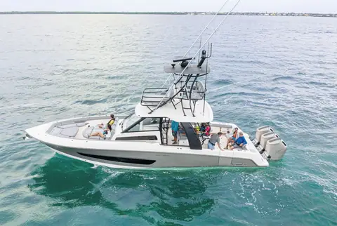 Boston Whaler 420 Outrage from above with guests in the bow and cockpit