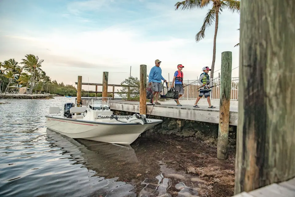 Boston Whaler 170 Montauk tied up at a wooden dock