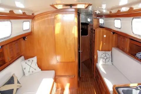 Mahogany main salon of a Bristol 40 with settees on both sides