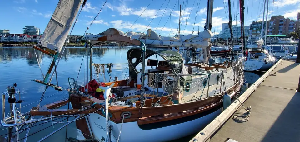 Bristol Channel Cutter 28 at a dock showing the boomkin, bulwarks and teak trim