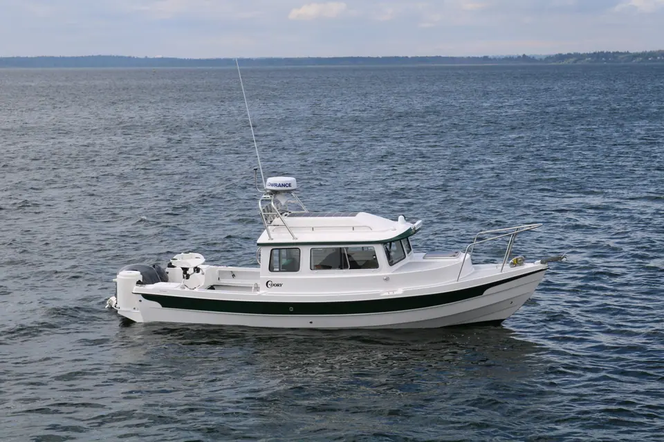 C-Dory 22 Cruiser in profile showing the pilothouse and flat sheer
