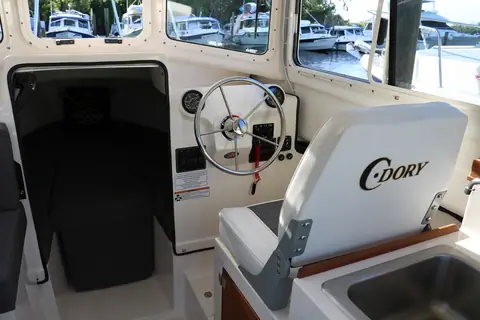 Helm and pilothouse interior of the C-Dory 22 Cruiser