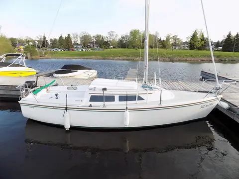 Catalina 22 tied up at a lakeside dock