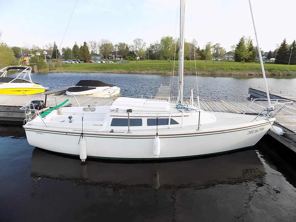 Catalina 22 tied up at a lakeside dock
