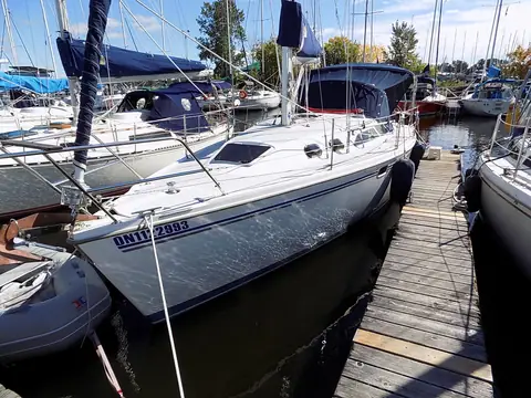 Catalina 320 berthed at a wooden marina dock